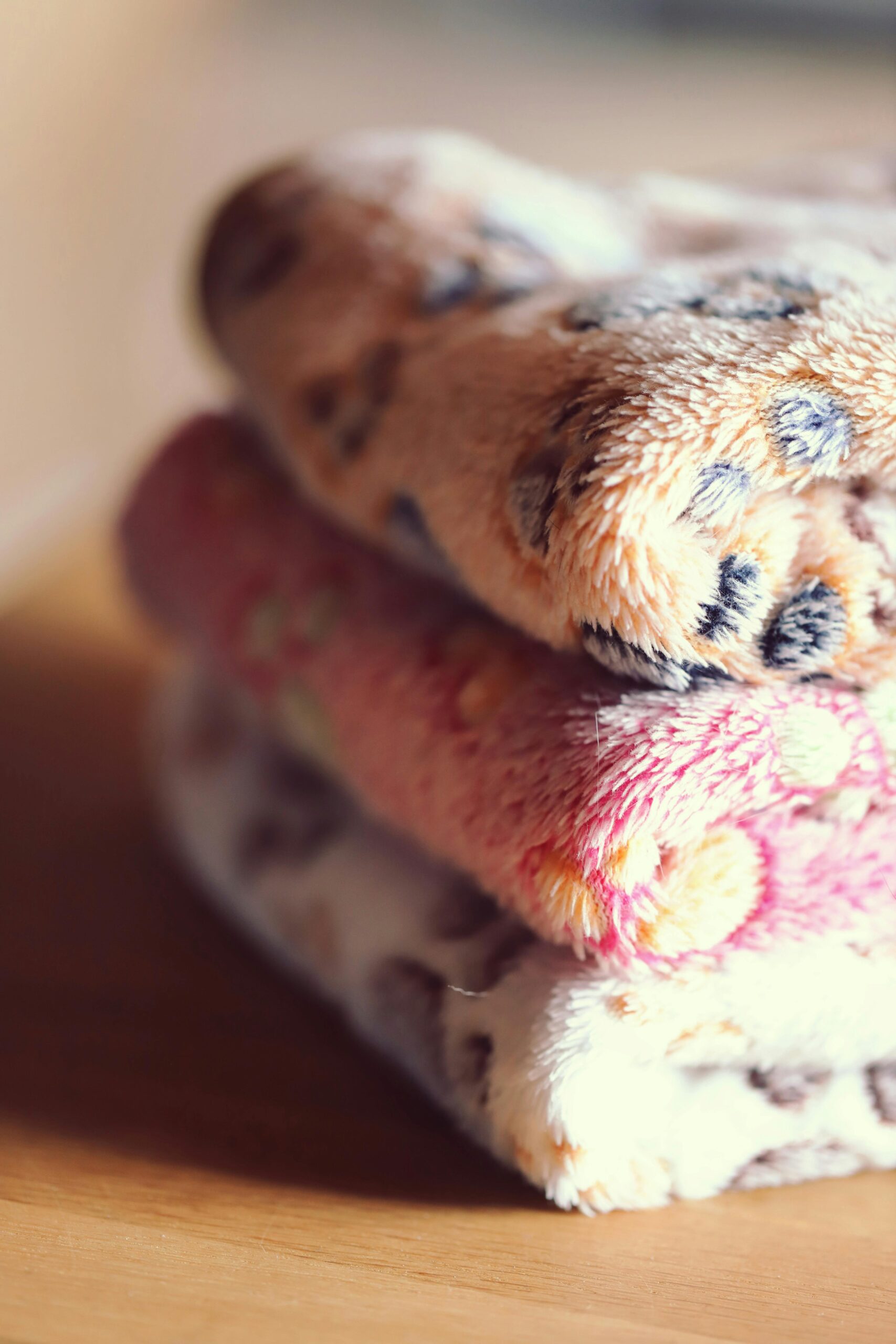 Comfortable stack of warm, patterned wool blankets. Perfect for cozy spaces.